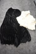 An antique black velvet cape.