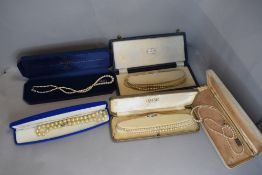 Five strings of simulated pearls of various forms