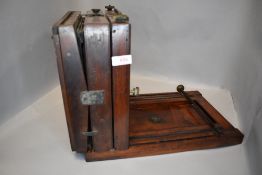 A selection of mahogany field camera parts