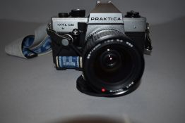 A Praktica MTL camera with Tokina 28-70mm zoom lens