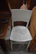 A traditional painted kitchen chair