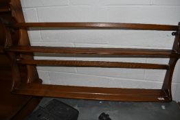 An Ercol mid elm wall Delft rack, w 38cm