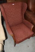 A traditional pine Parker Knoll armchair having wood detail