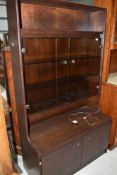 A vintage style dark stained and smoked glass lounge unit , nice size at just 100cm wide
