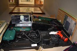 A lot containing power tools including drill and electric sharpener.