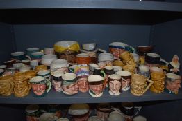A collection of novelty character and Toby style jugs.