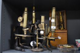 A selection of 19th century microscopes,wooden box, and pieces, including Ernst Leitz.