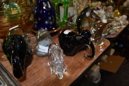 Eight glass paper weights including Murano fish and and Wedgwood bird.