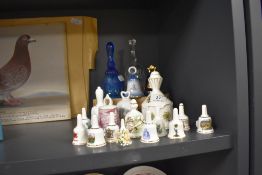 A selection of miniature ceramic and glass ringers and hand bells