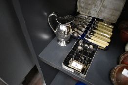 An assortment of flat ware including Fish knives in box , sugar nips, tea spoons and more.