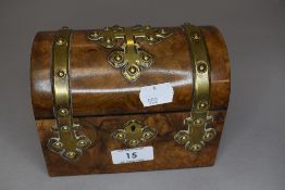 A pair of cut glass scent or perfume bottles in a miniature domed strong box chest with brass