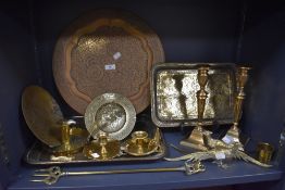 Am assortment of vintage and antique brass ware including candle sticks, trays and more.