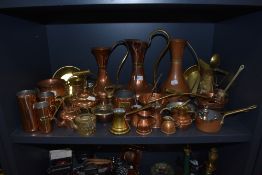 A good collection of copper and brass items including measures, teapots,cider measure and more.