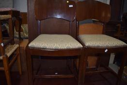 A pair of vintage ply back dining chairs
