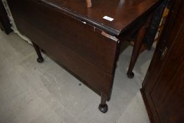 A Victorian drop leaf mahogany dining table