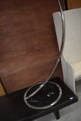 A modernist standard lamp in brushed chrome, height approx. 195cm
