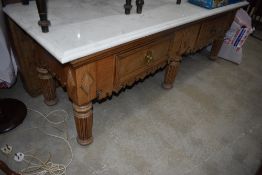 A traditional butchers block/dresser base having carved head ledge back and original wood and
