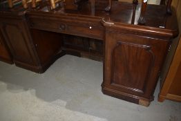 A Victorian mahogany sideboard , having rosette to central frieze drawer (no back), width approx.