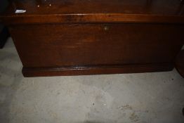 An Edwardian oak cased bedding box