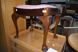 A traditional piano stool