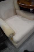 A traditional armchair, stripped for recovering