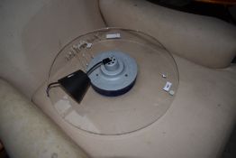 A modern perspex ceiling light fitting