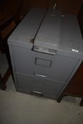 A vintage two drawer filing chest with additional security system