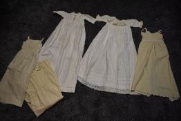 A collection of Victorian childrens under garments/pinafores in wool and cotton dresses, some lovely