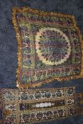 Two vintage fringed ethnic cloths in vibrant colours.