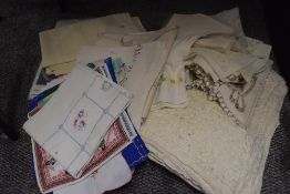 A mixture of vintage and retro table linen, included are embroidered examples and tray cloths/mats.