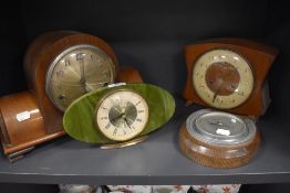 A selection of art deco mantle clocks including stone effect and an oak cased barrometer