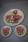 Two modern pin dishes by Moorcroft and a matching larger plaque or plate