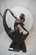 A modern art deco design lamp with dancing lady figure