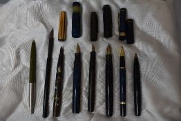 A selection of fountain pens and ball point pen, including a Parker Duofold in black, a Chatsworth