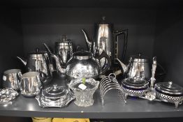 A selection of stainless steel kitchen wares including tea set and kettle
