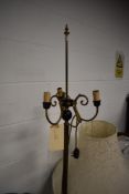 A vintage brass three branch standard lamp