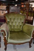 A reproduction Victorian style armchair having scroll frame and knurl legs