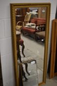 A gilt frame full length wall mirror, approx. 132 x 55cm
