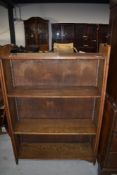 A set of Arts and Crafts open bookshelves having adjustable shelves, width approx. 93cm