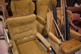 Four various mid 20th century armchairs, having matching yellow moquette upholstery