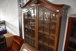 A nice quality early 20th Century mahogany bureau bookcase having ball and claw feet