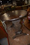 A vintage oak oval occasional table, width approx. 66cm