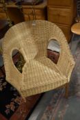 A wicker tub chair