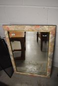 A modern floral wall mirror