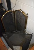 A selection of fire guards including brass and glass
