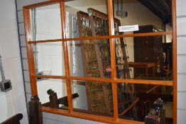 A 1970's design window mirror, w 109cm
