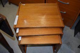 A vintage teak nest of G plan or similar tables, stamped 820