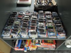 A shelf containing 140 Mattel Hot Wheels diecasts all in blister card packs including 2008 40 year