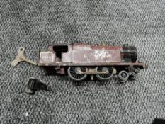 A playworn Hornby 0 gauge clockwork 4-4-2 LMS Locomotive 2323 with key