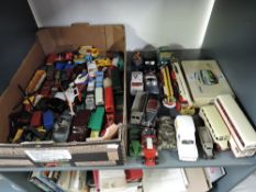 A shelf of mixed vintage diecasts, early Dinky through to modern Corgi including Military.